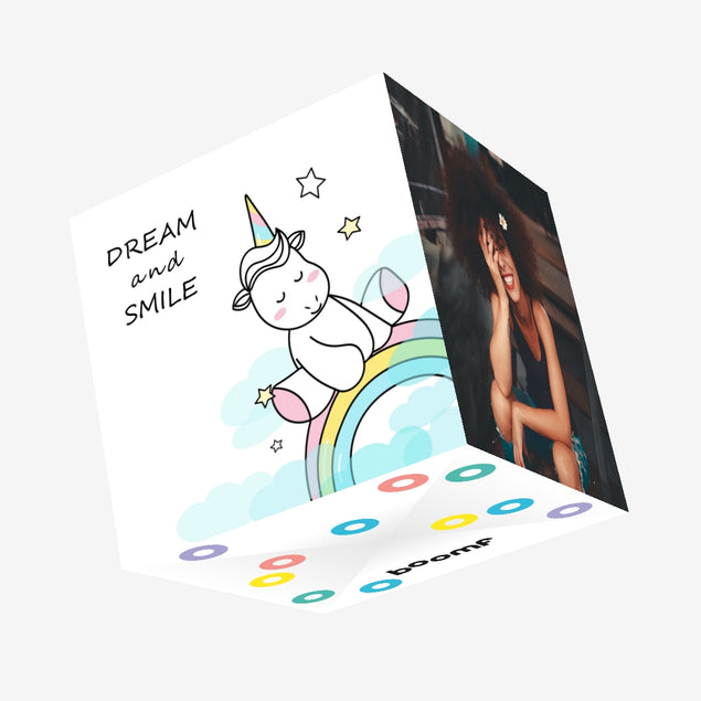 Dream And Smile Unicorn Sitting On The Rainbow Confetti-exploding Greetings Card